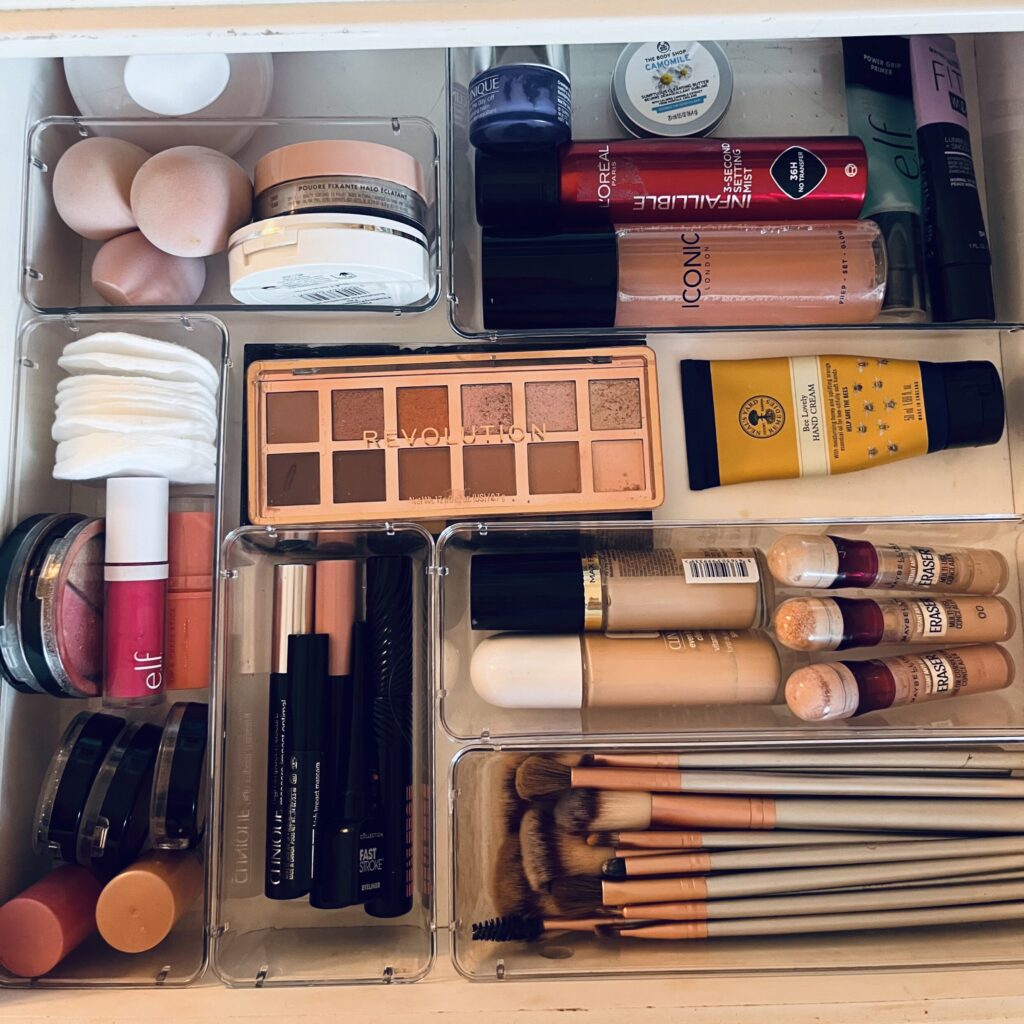 Organised vanity drawers with makeup and brush storage trays