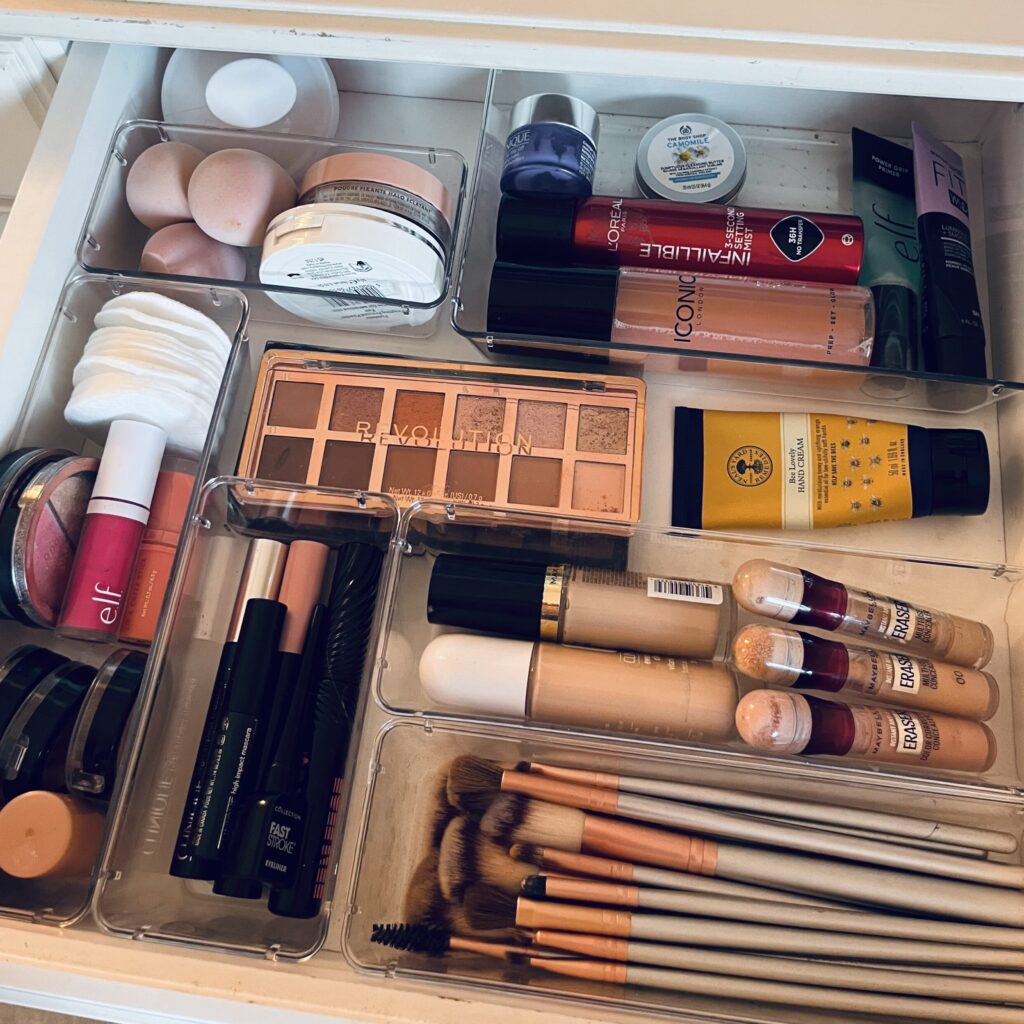 Organised vanity drawers with makeup and brush storage trays