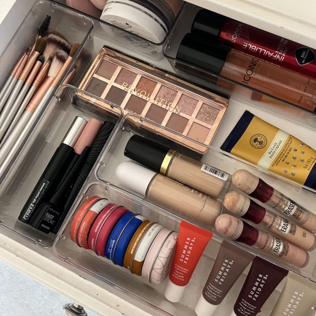 Organised vanity drawers with makeup and brush storage trays