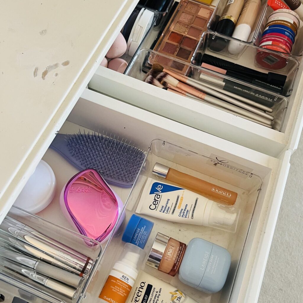 Organised vanity drawers with makeup and brush storage trays