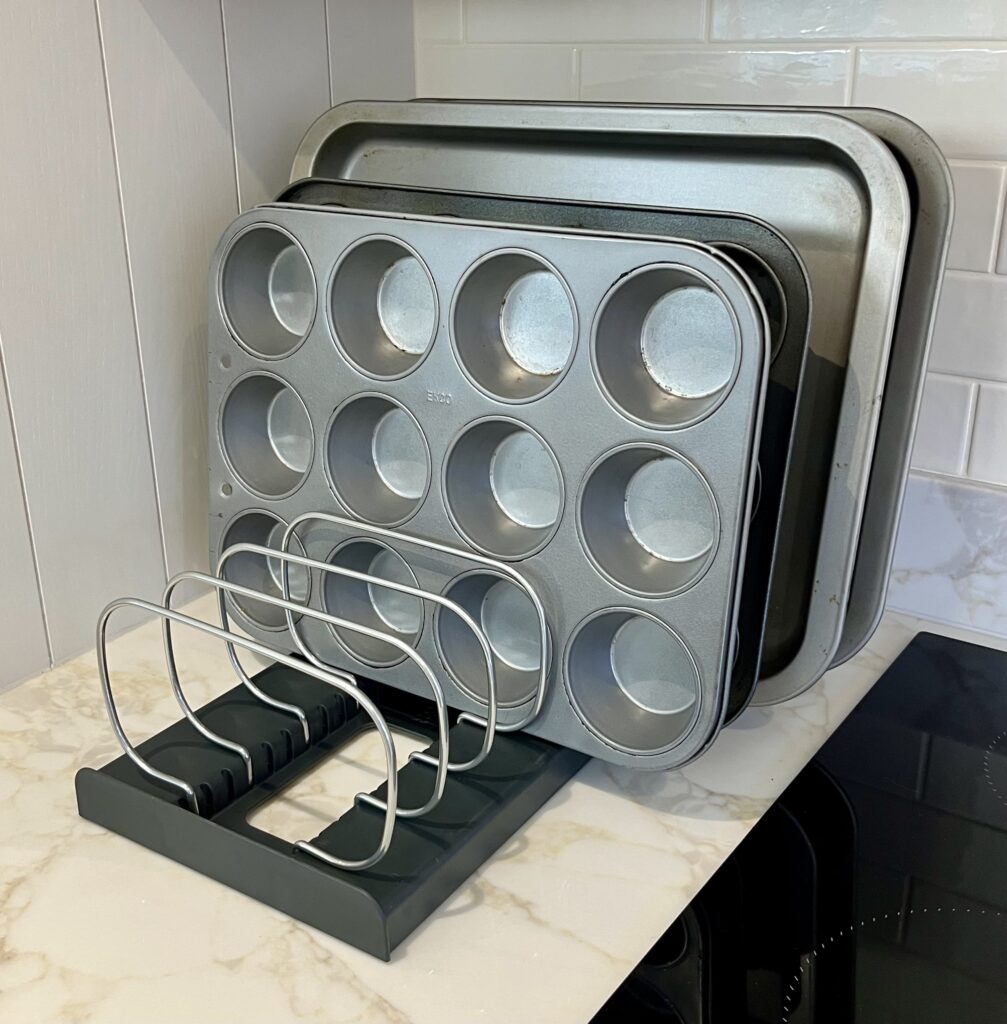 Organised baking trays and sheet pans in vertical storage rack