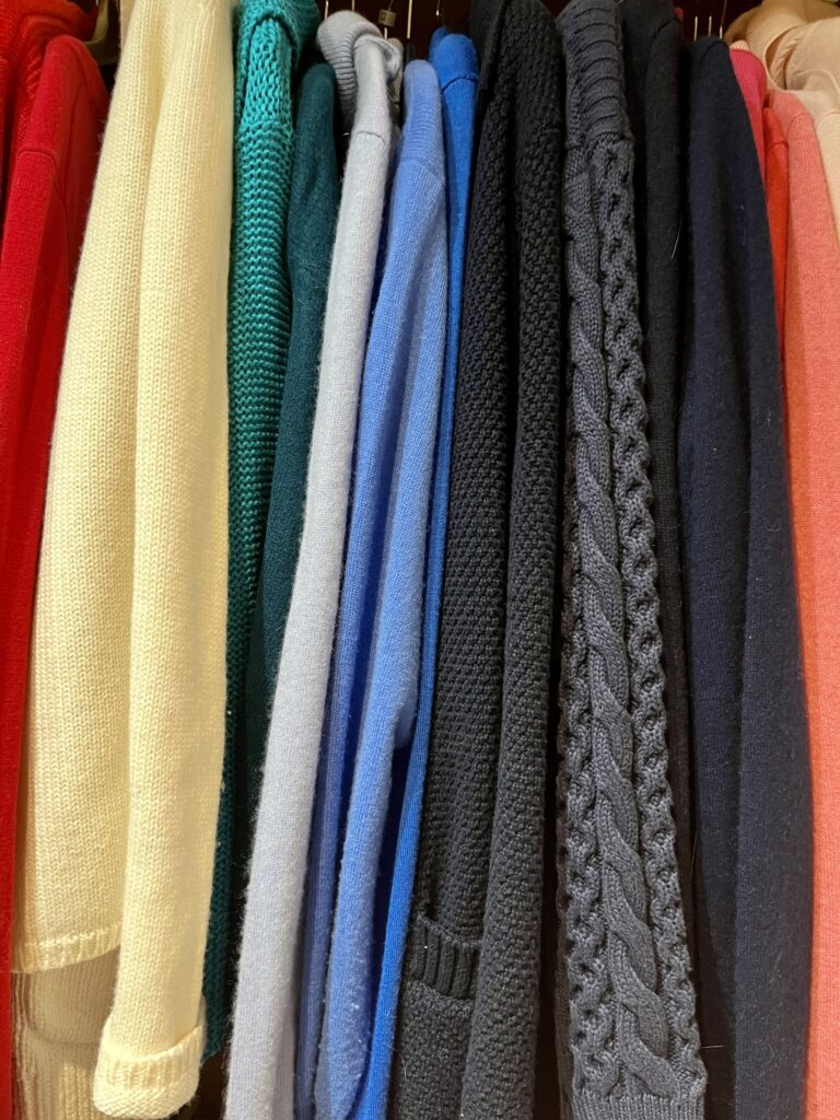 Colour-coded organised wardrobe with matching hangers