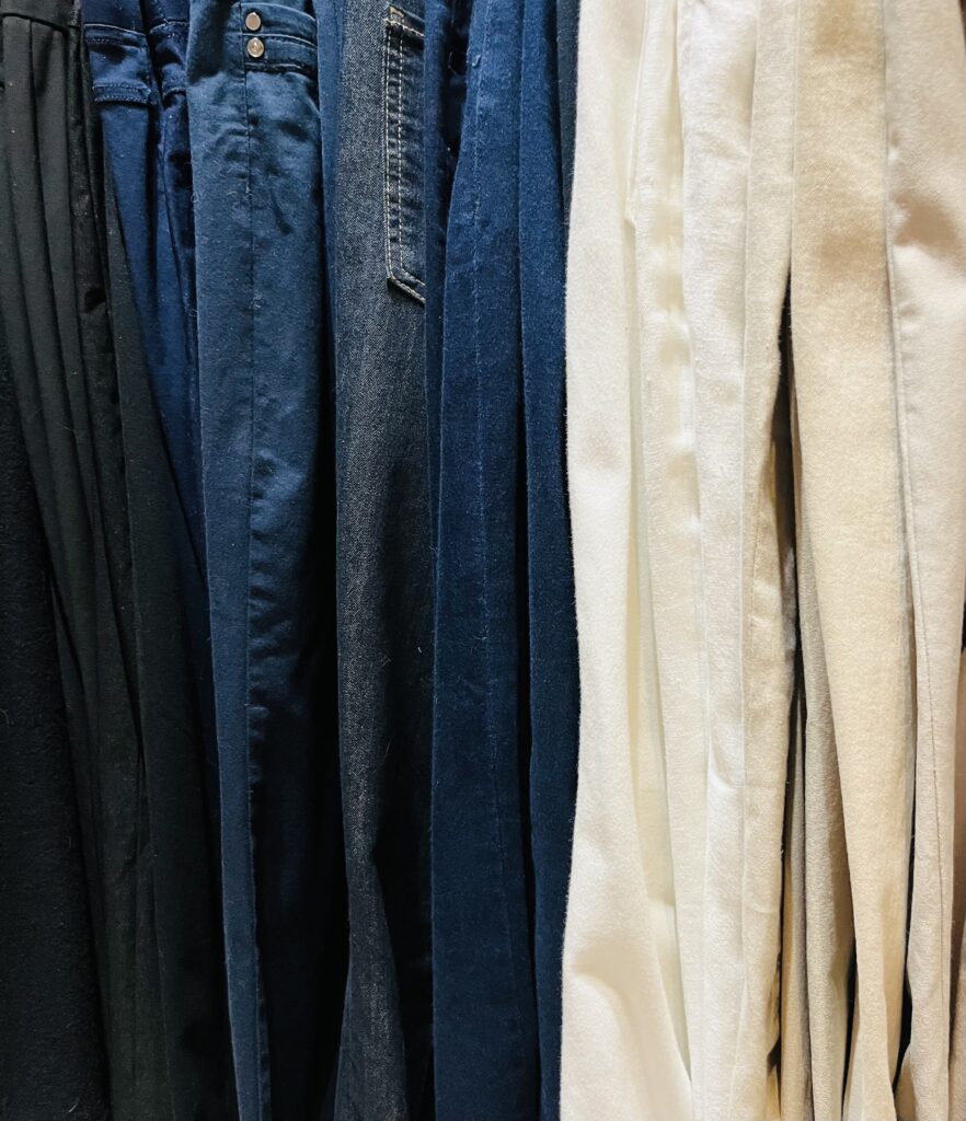 Colour-coded organised wardrobe with matching hangers