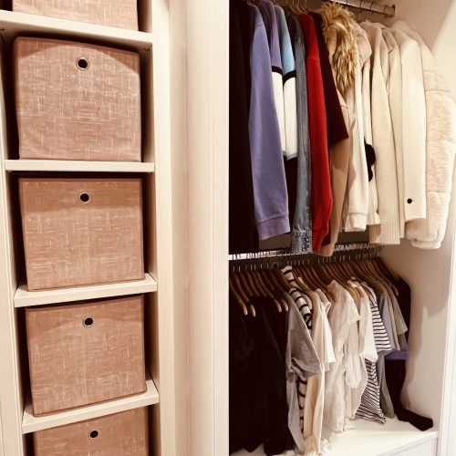 Colour-coded organised wardrobe with matching hangers